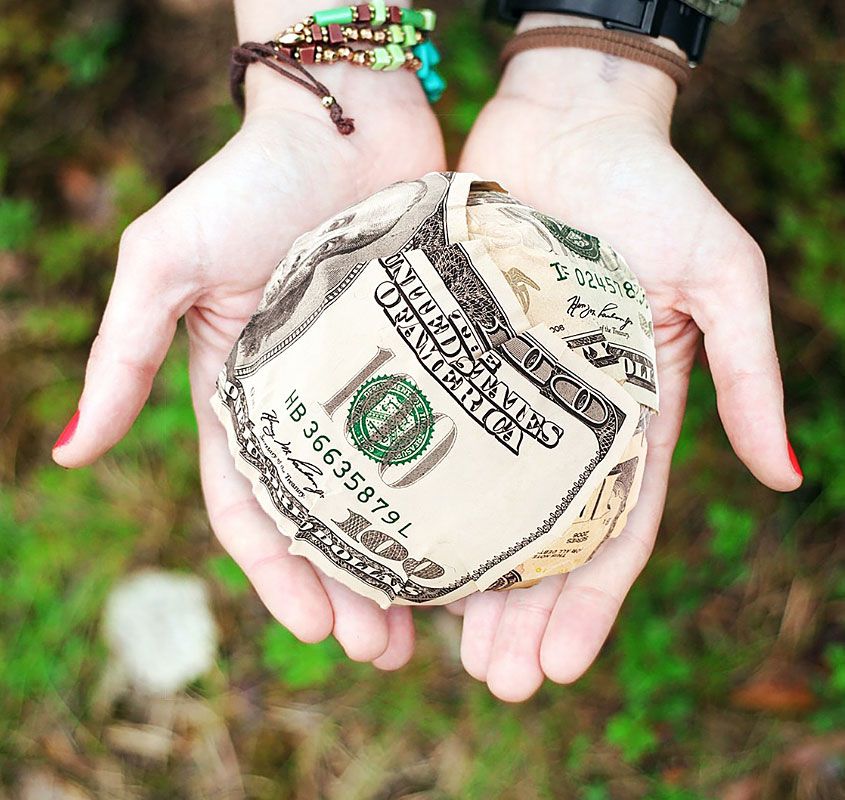 Hands Holding Money Ball Hands Holding Money Ball